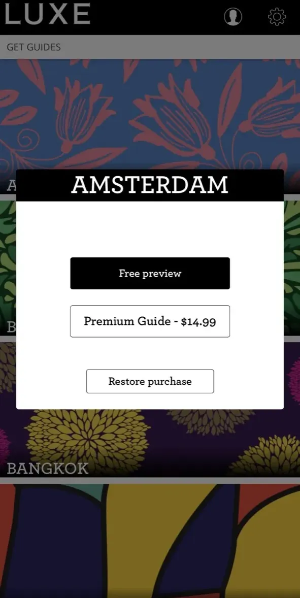 The paywall screen of the LUXE City Guides app